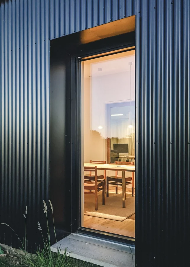 Corrugated facade with entry